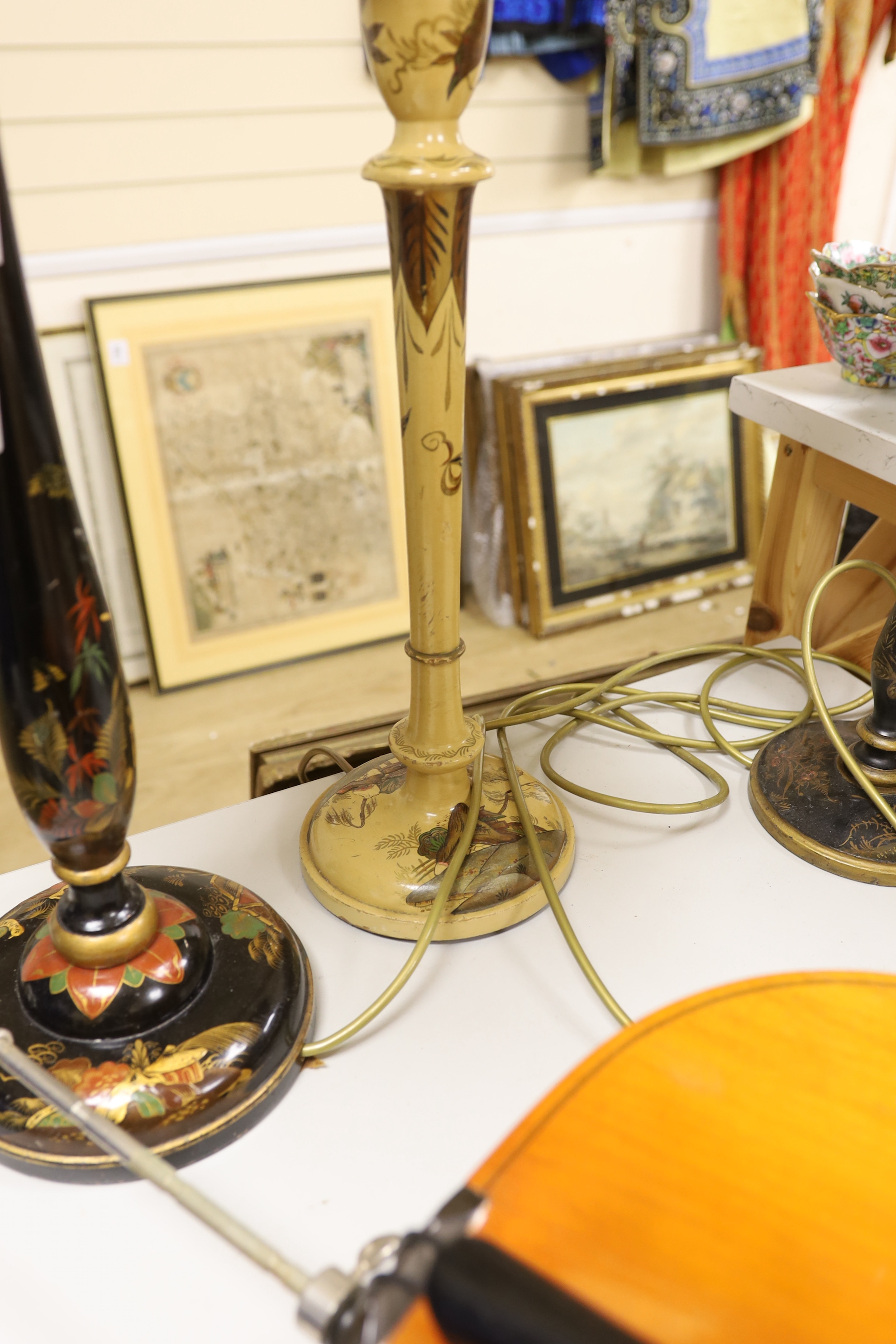 Two chinoiserie japanned table lamps and another